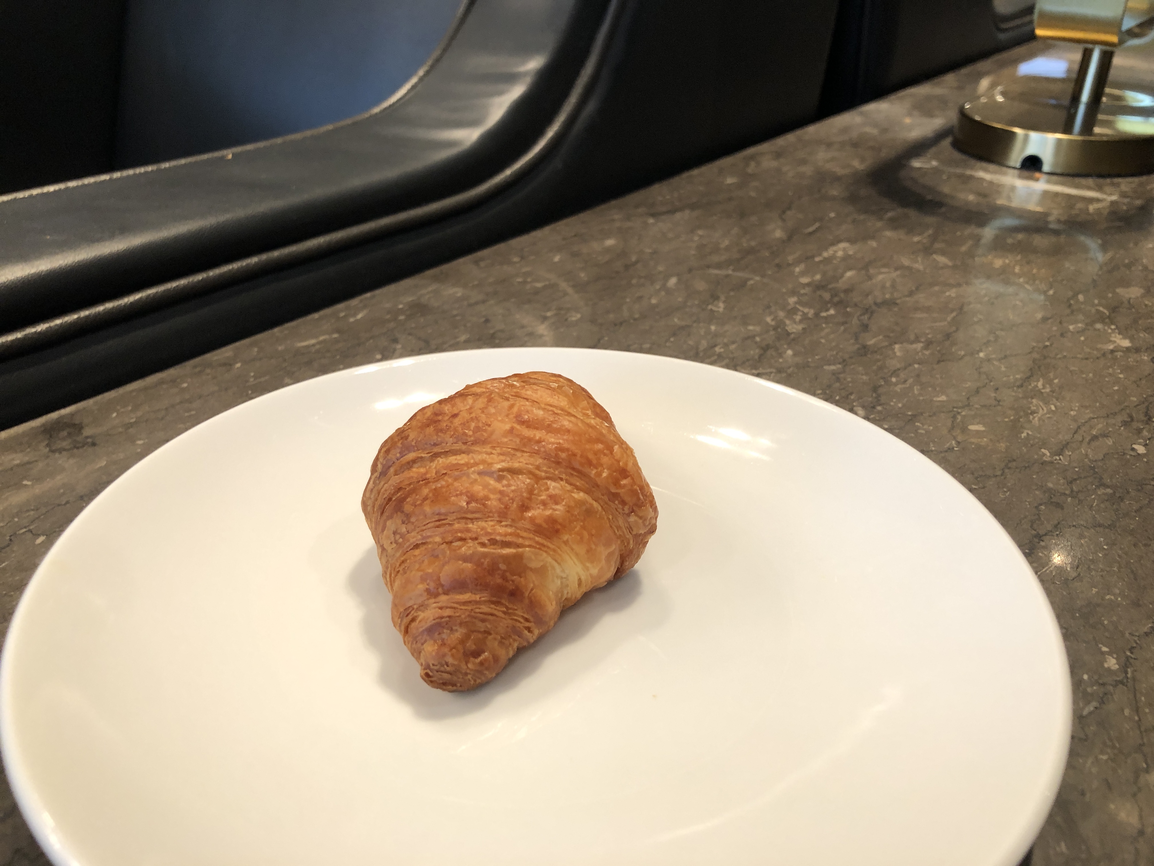 a croissant on a plate