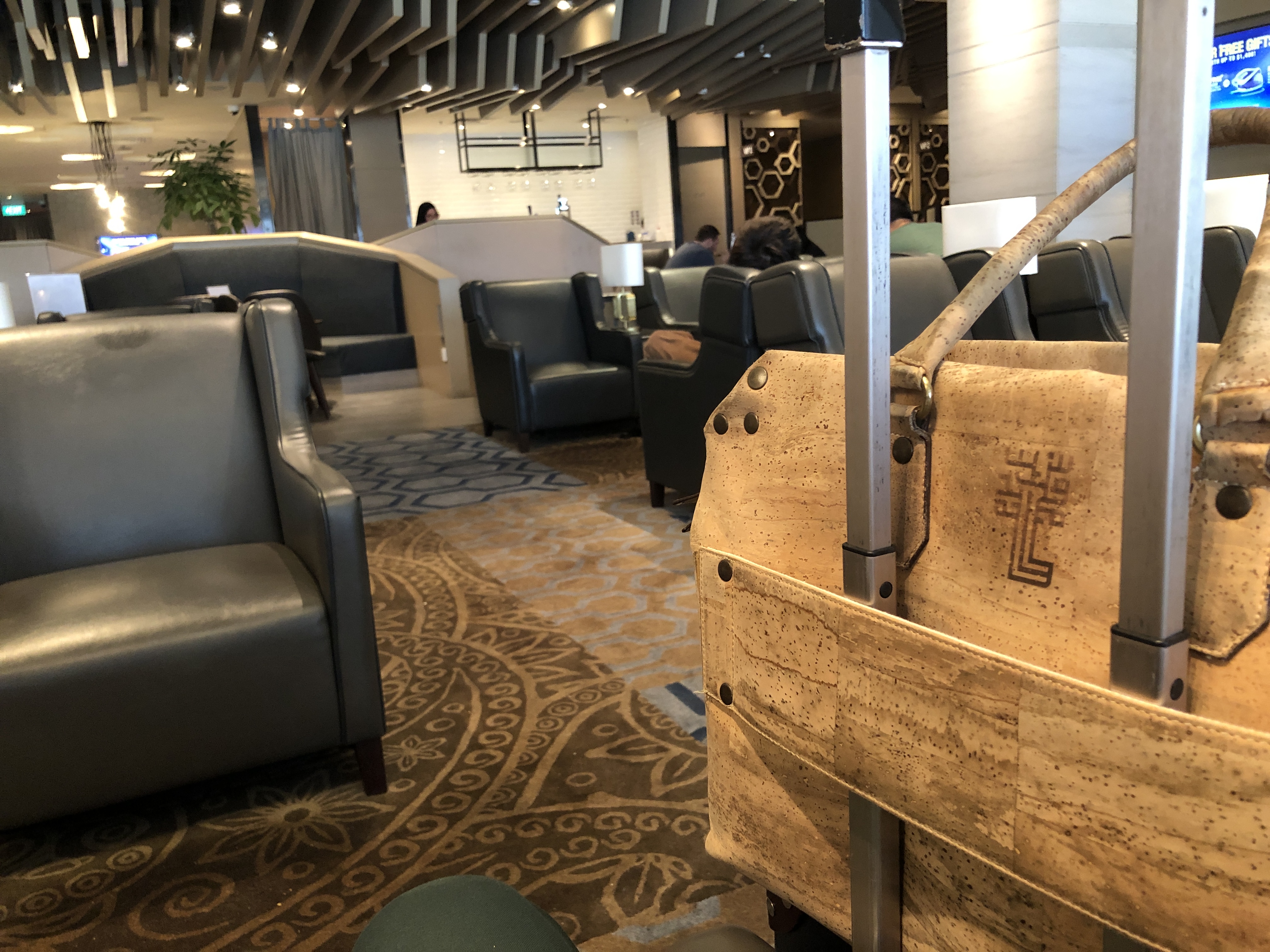a room with chairs and a large wooden basket