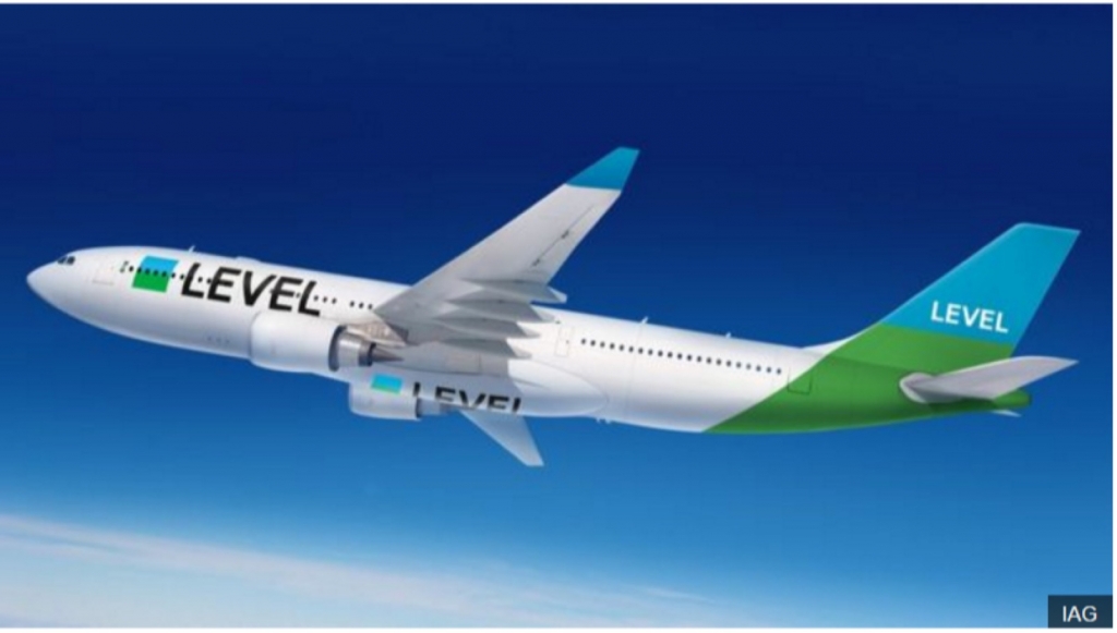 a white and green airplane in the sky