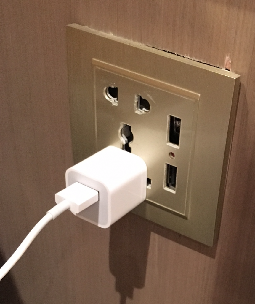 a white plug in a wall outlet