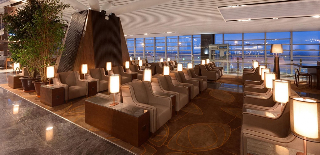 a room with chairs and lamps