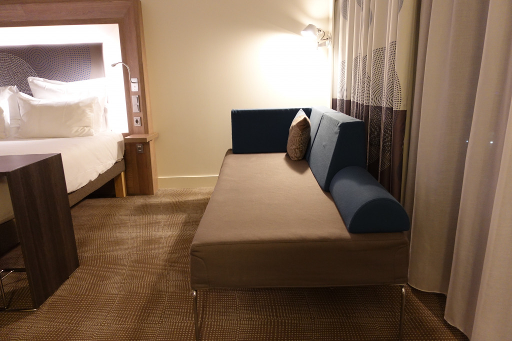 a couch and a bed in a room