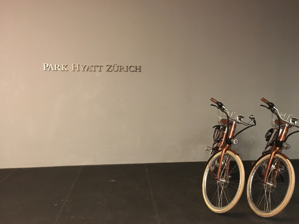 two bikes parked against a wall