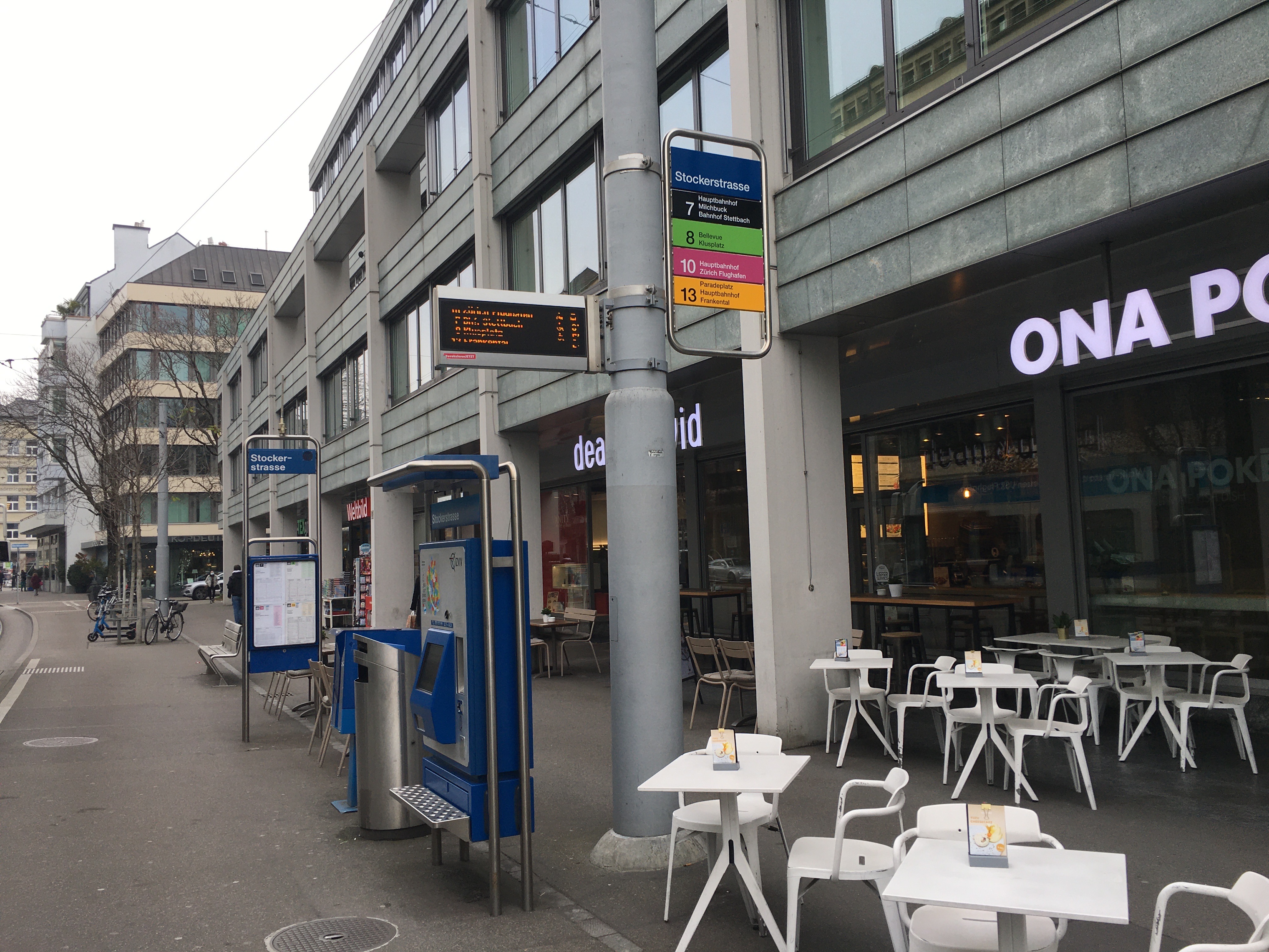 a street with tables and chairs
