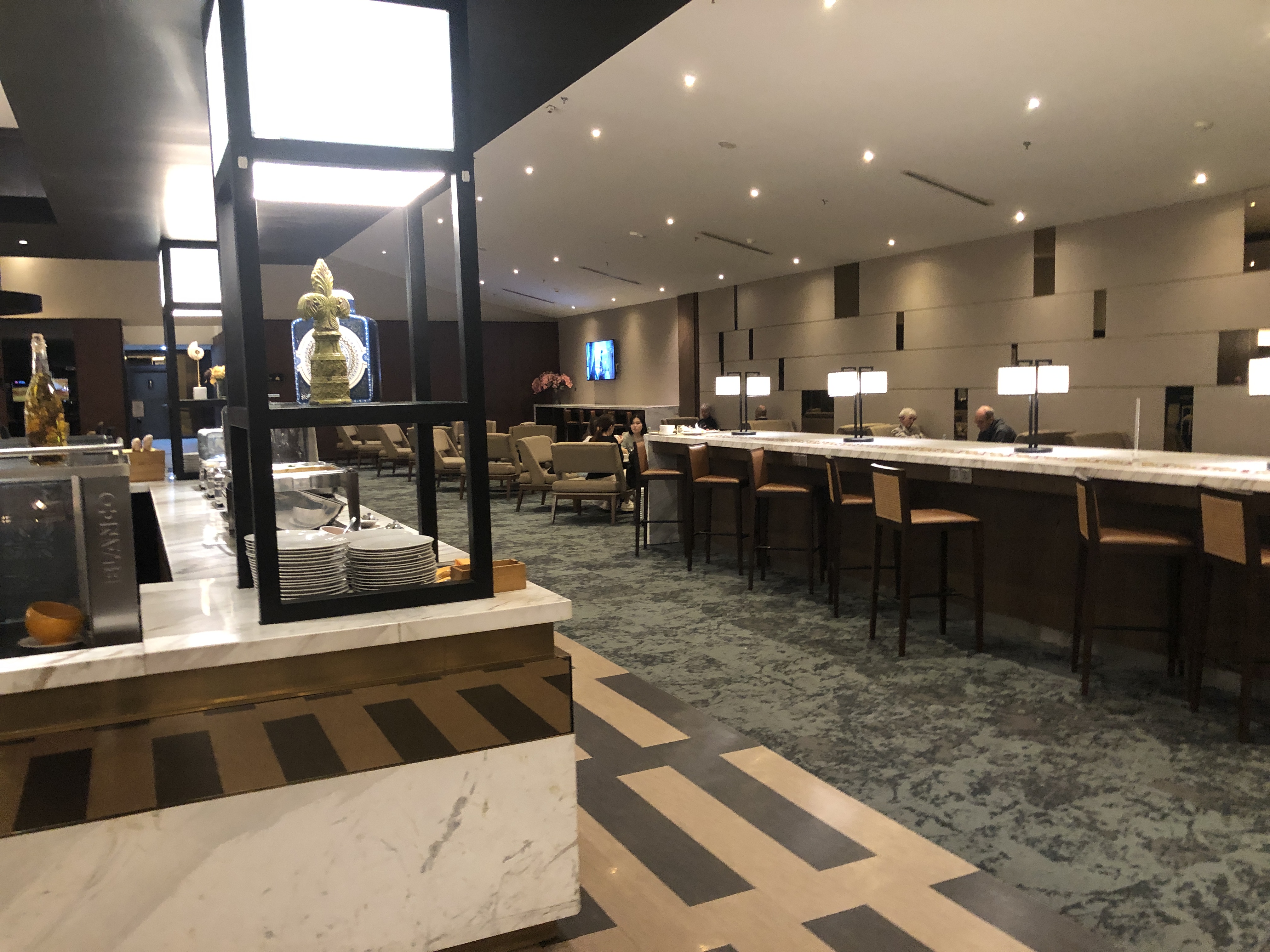 a room with a bar and chairs