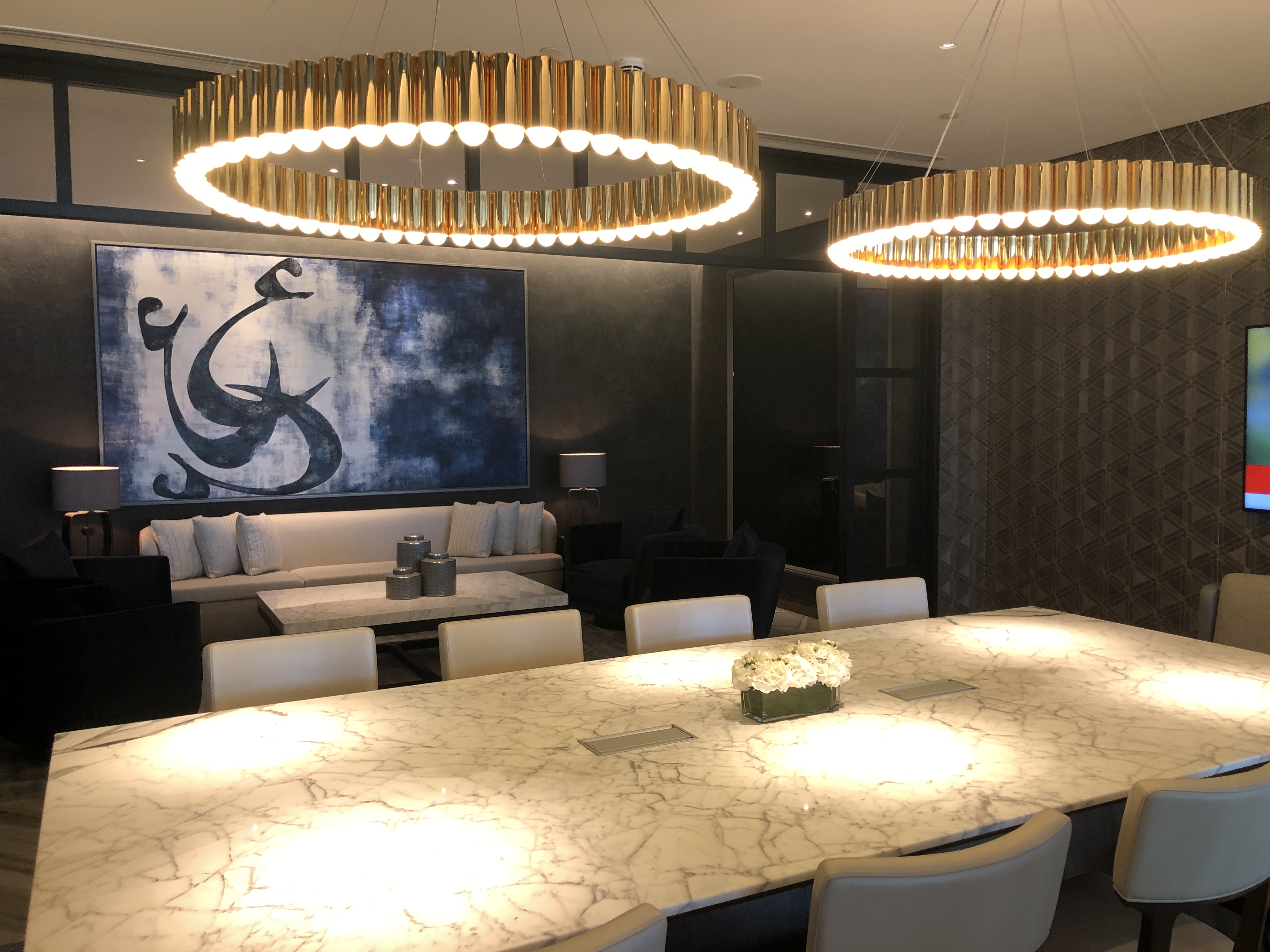 a room with a large table and chairs