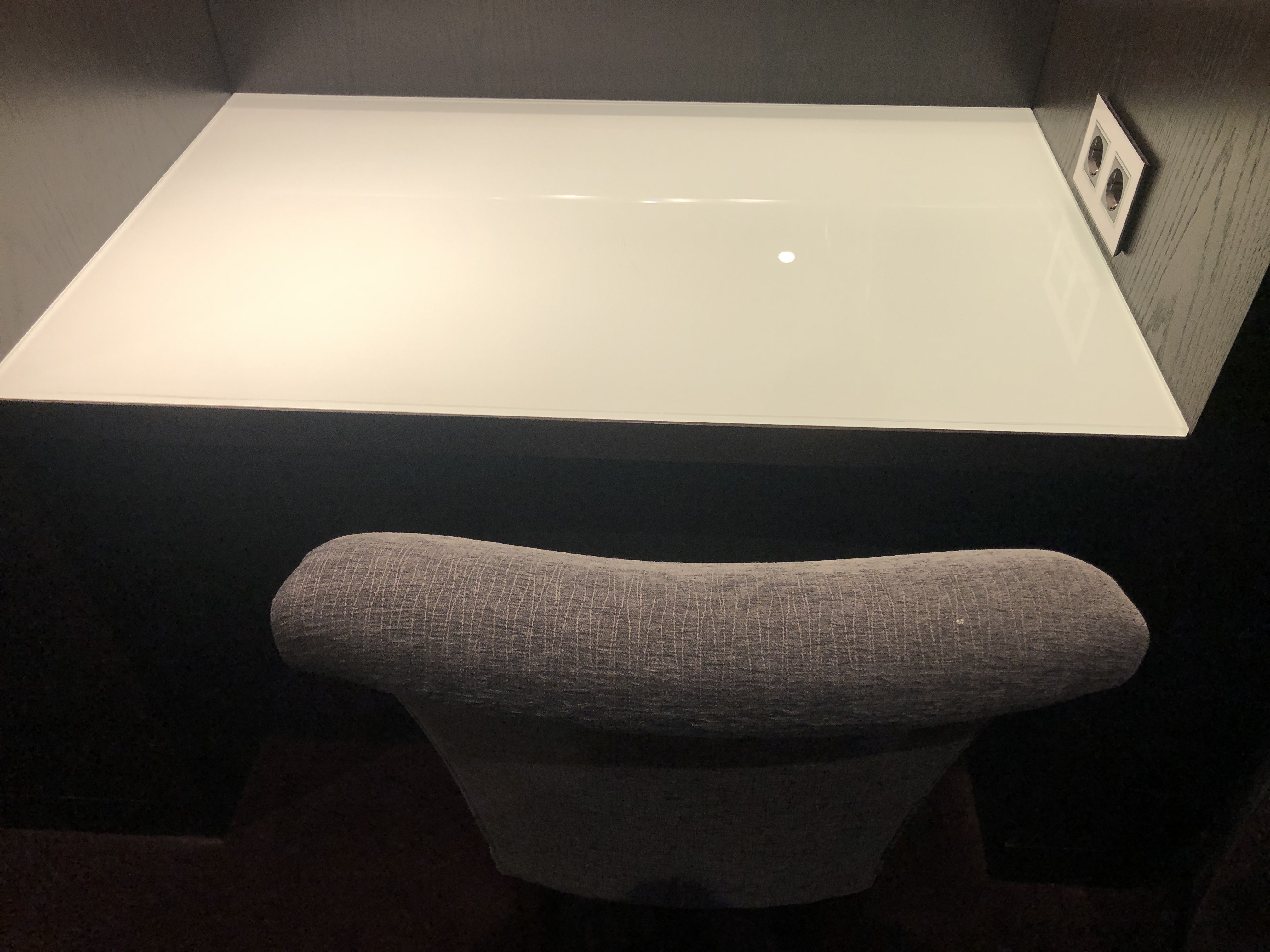 a desk with a white surface