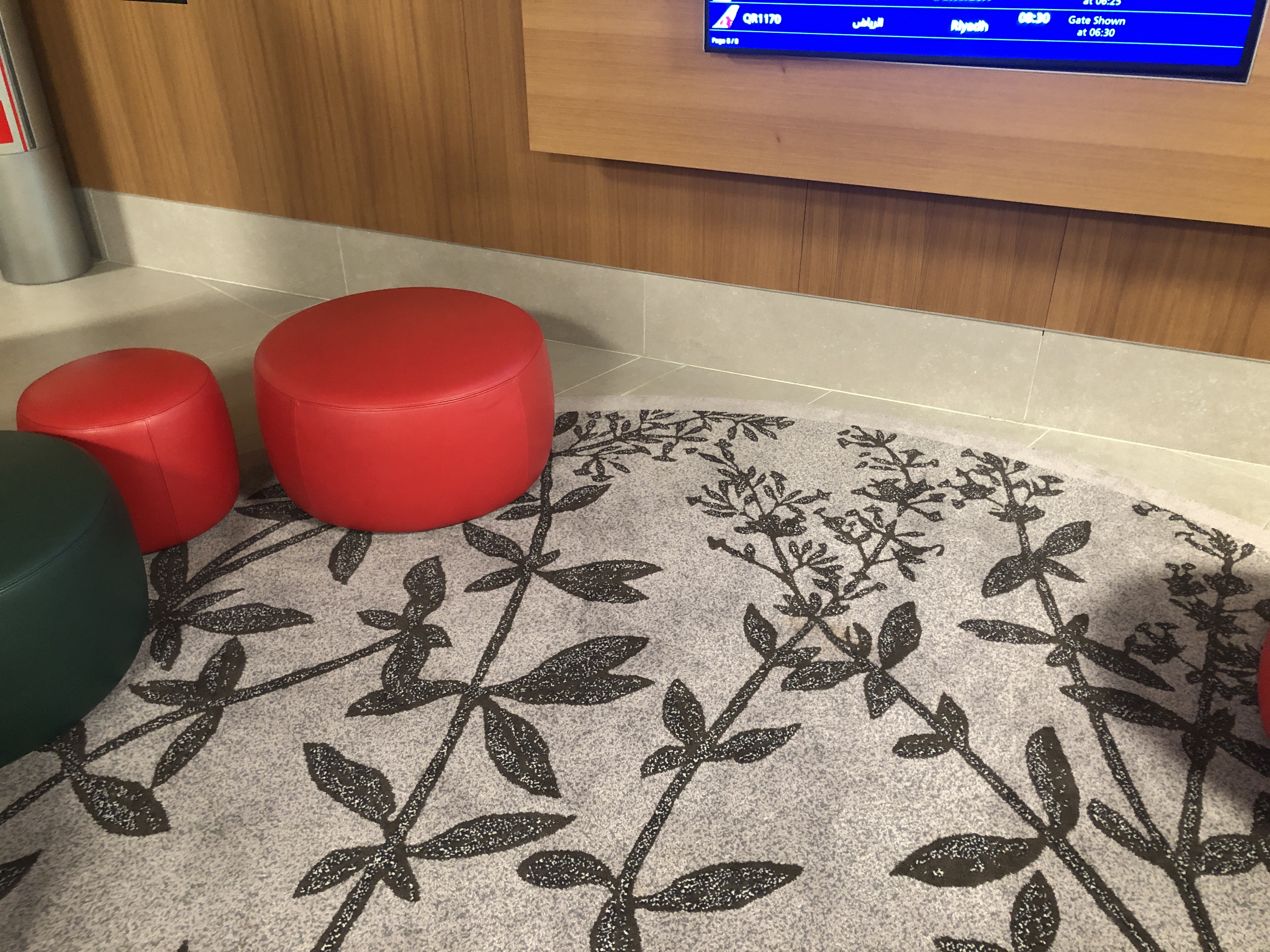 a red stools on a carpet