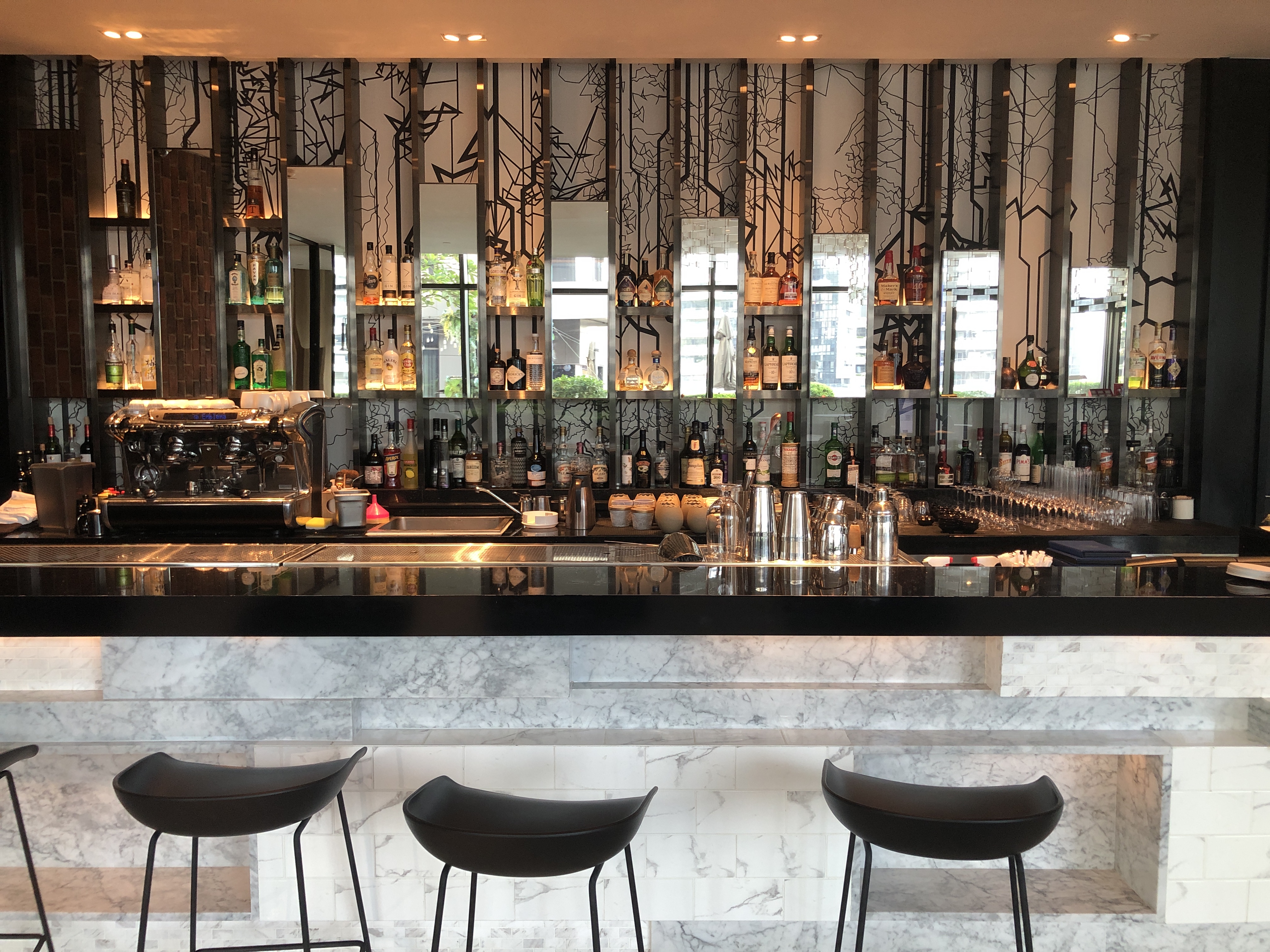 a bar with many bottles of alcohol