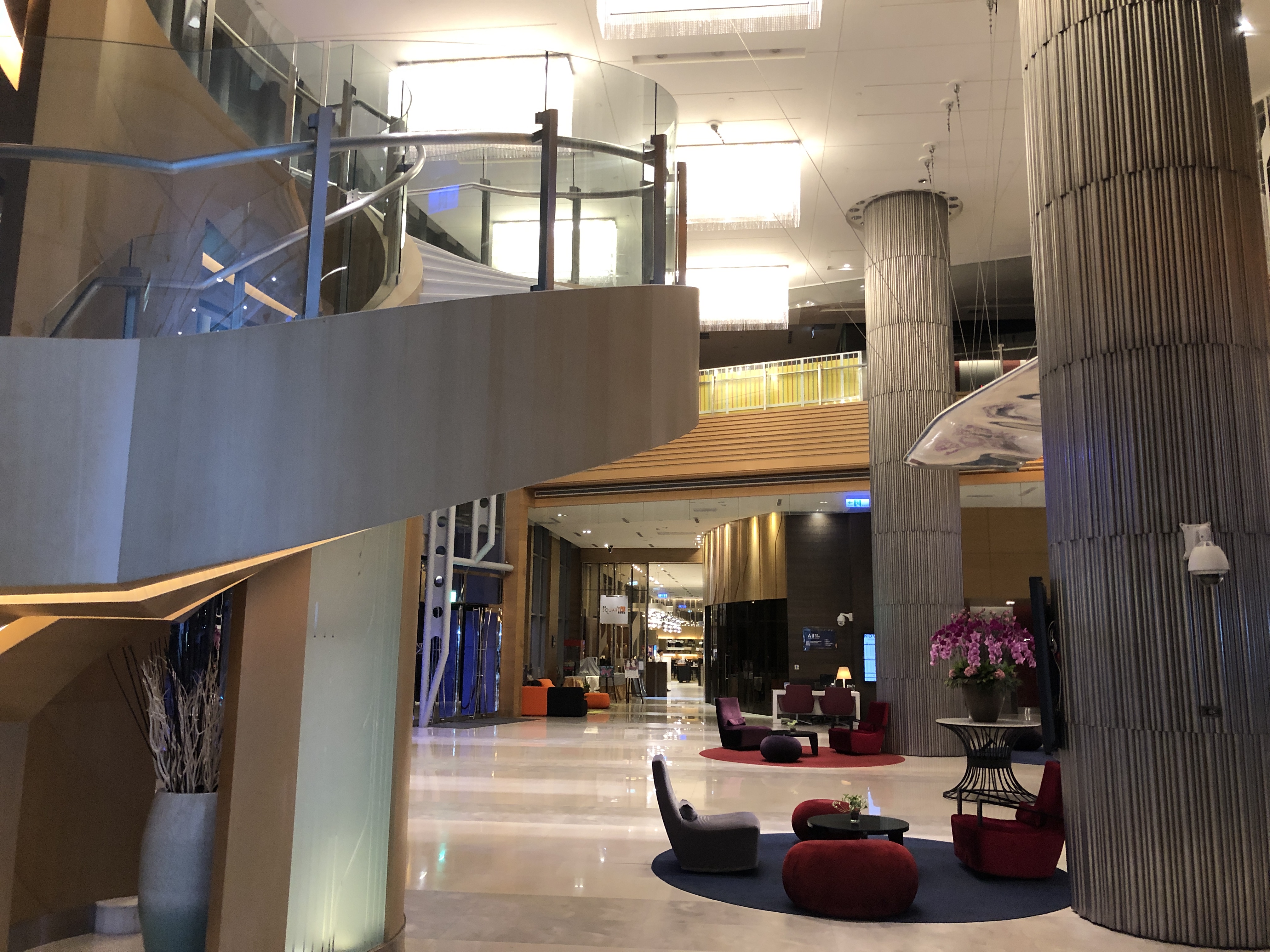 a lobby with a staircase and a large staircase