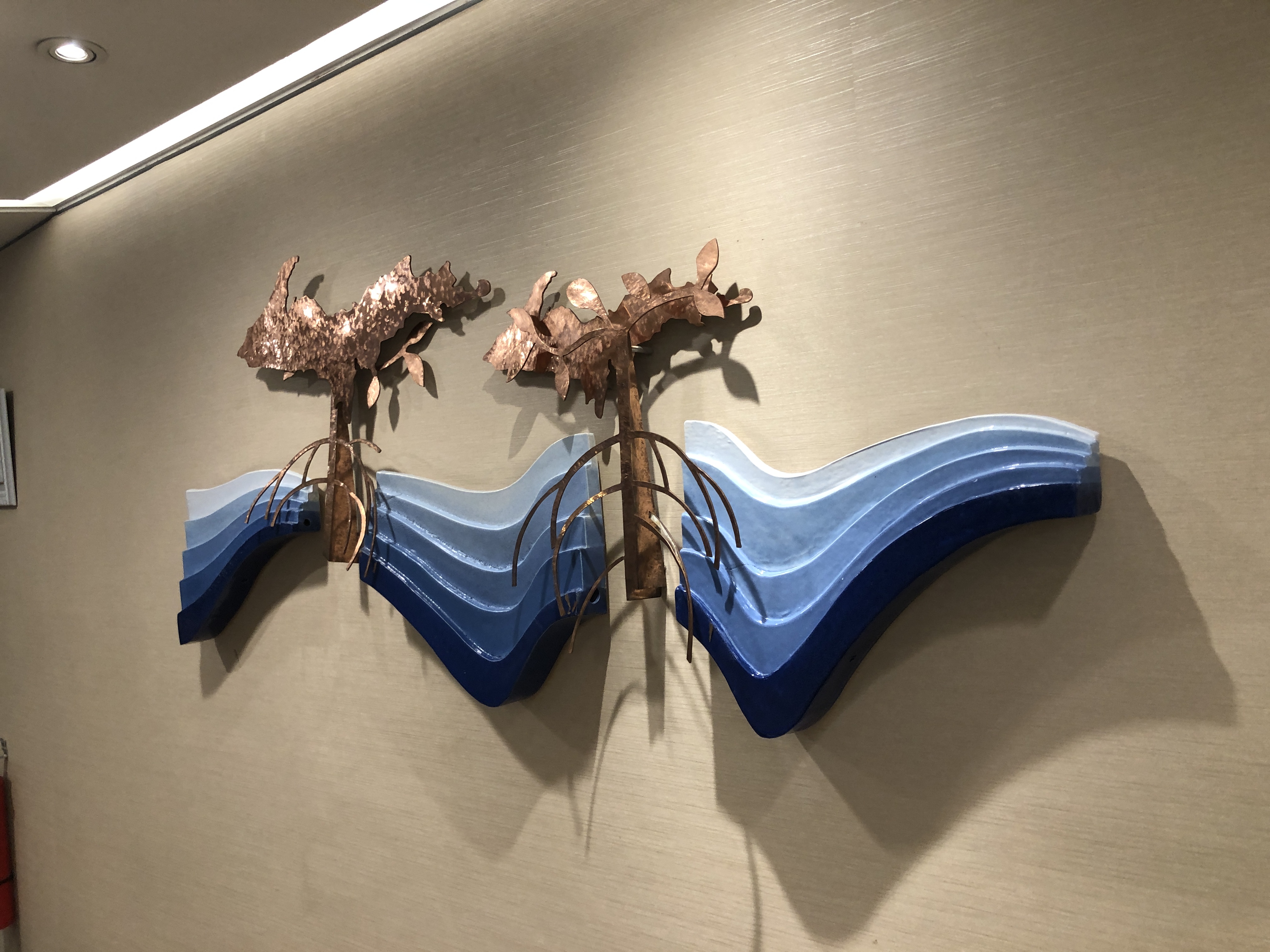 a sculpture of a lobster on a wall