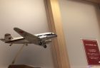 a small airplane flying over a staircase
