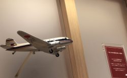 a small airplane flying over a staircase