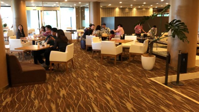 a group of people sitting at tables
