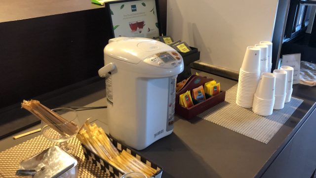 a white coffee maker on a counter