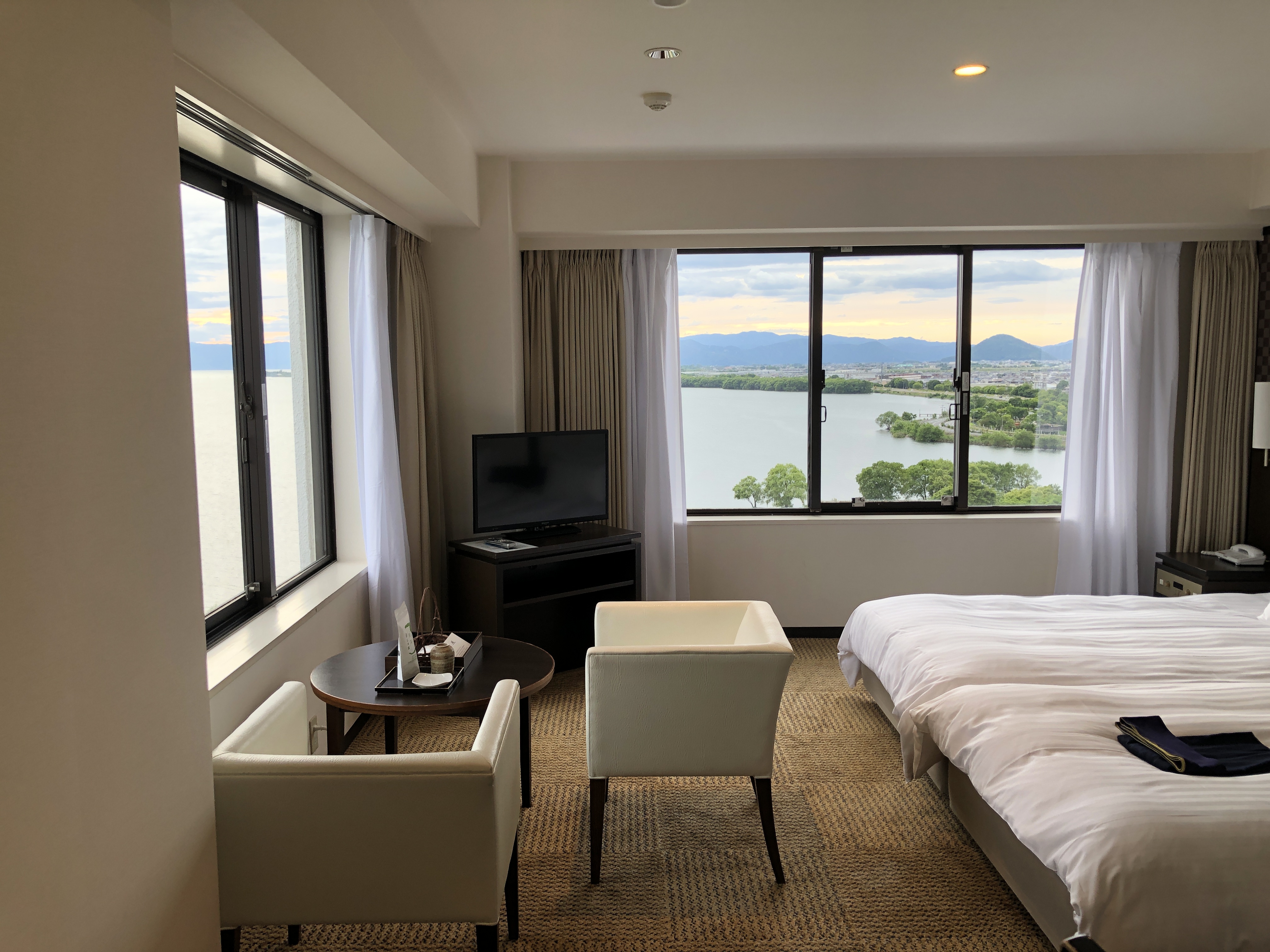 a bedroom with a large window