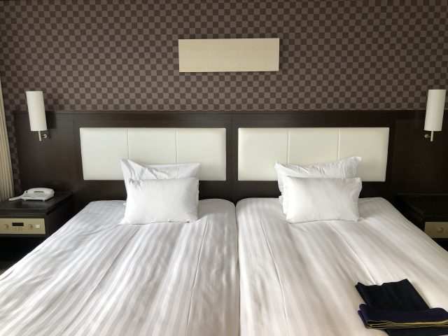a hotel room with two beds