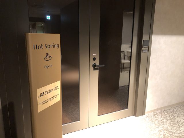 a sign on a glass door