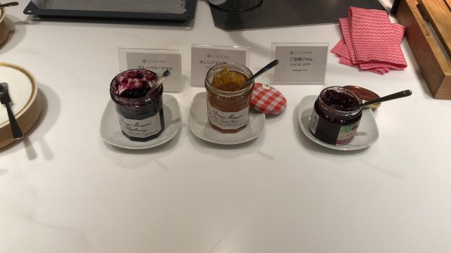 a group of jars with food in them