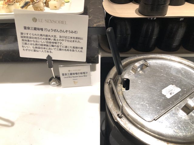 a black pot with a sign on it