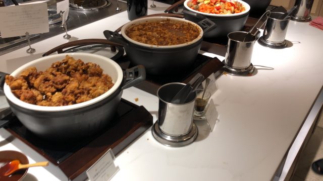 a couple of pots with food in them on a stove