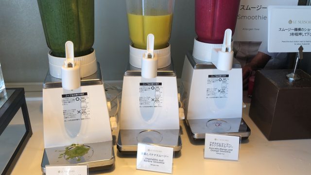 a group of perfumes on a table